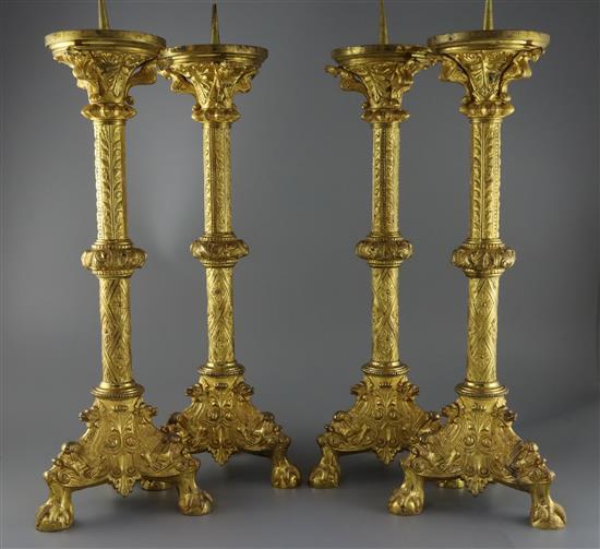 A set of four 19th century French Henri II style ormolu pricket candlesticks, H.24in.